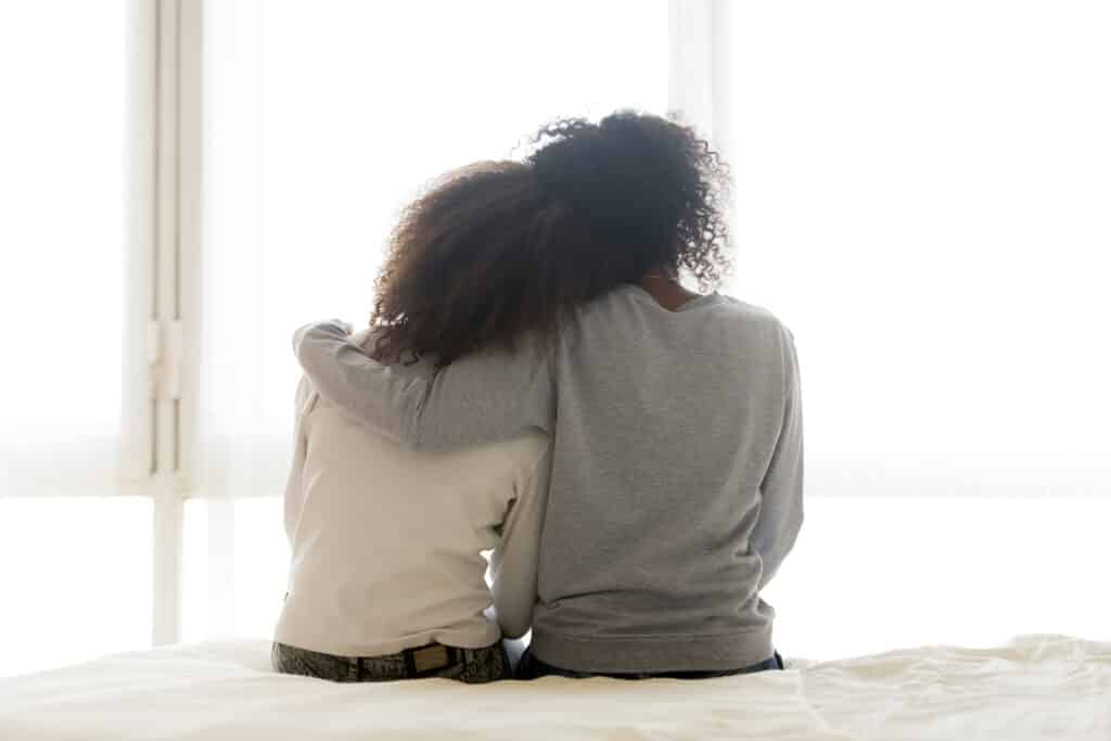 Two people sitting side by side