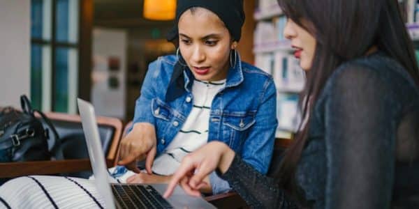 Women looking at something on laptop together