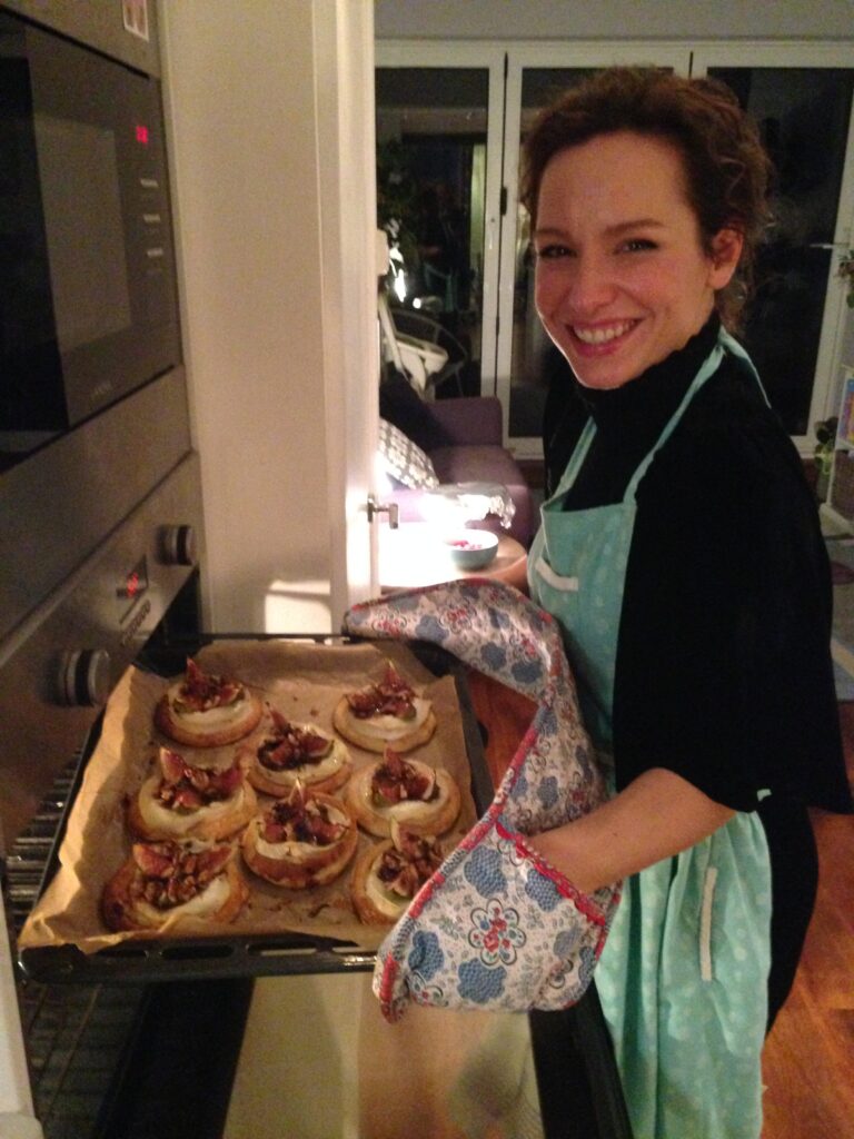 Woman standing with baked goods