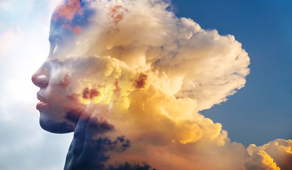 Photo of woman's face transitioning from clouds
